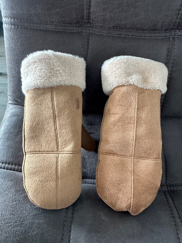 Brown gloves, lined, one of them stained.