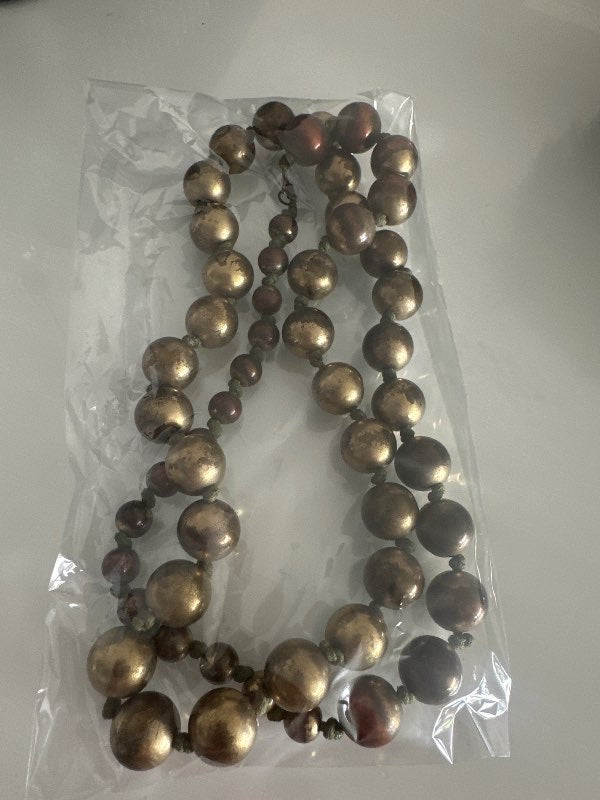 Long necklace with gold and brown beads