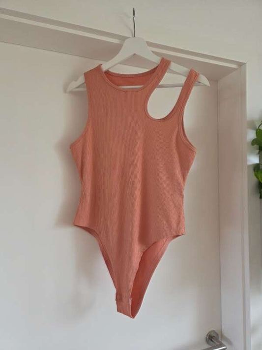 Beige-coloured footed sleepsuit