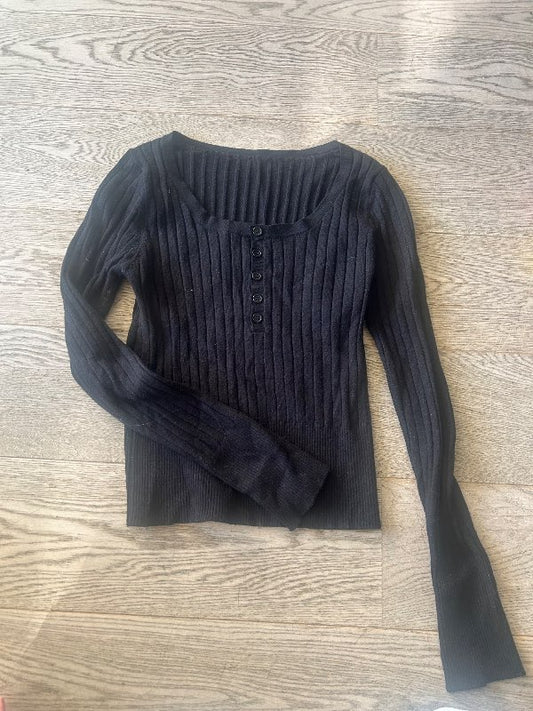 black tight-fitting sweater