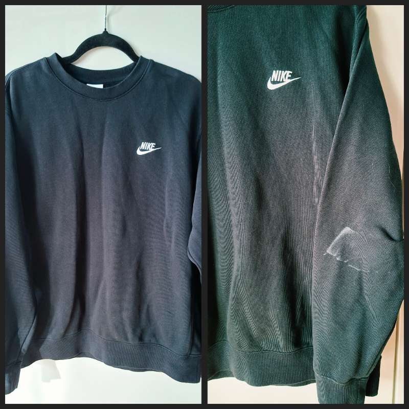 Peysa (NIKE), svört m/ bletti á ermi