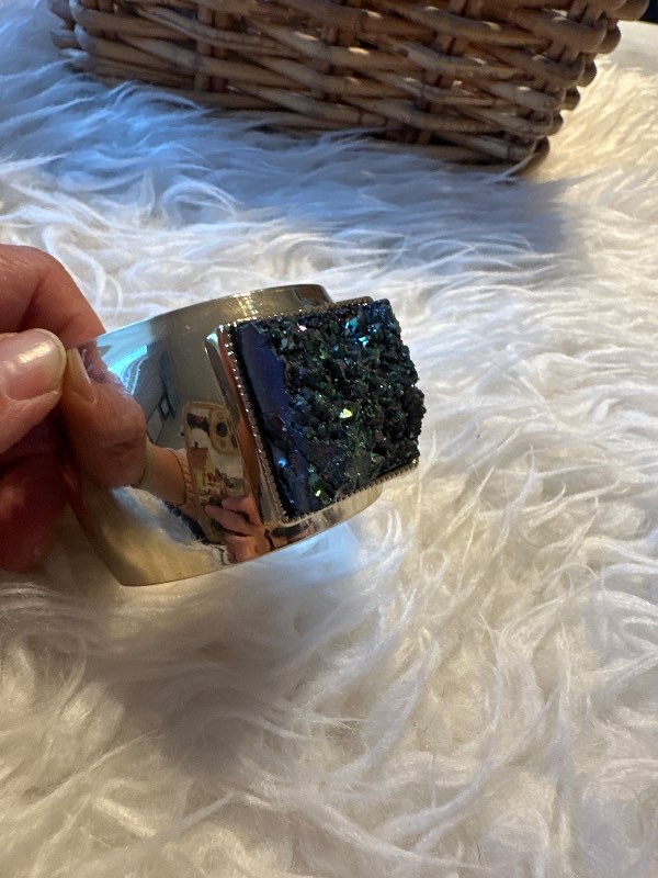 Golden bracelet with a stone