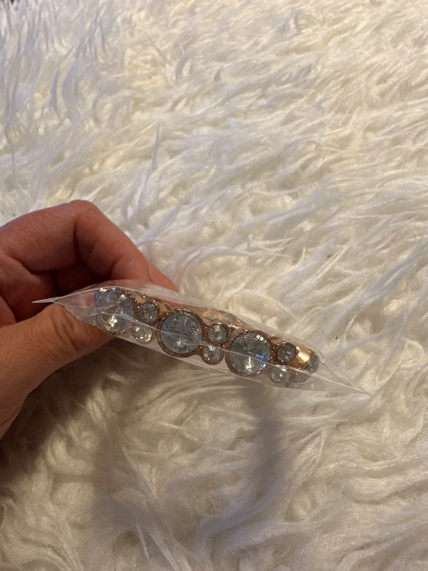Gold bracelet with clear stones